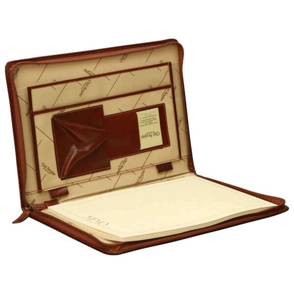 An open, tan leather portfolio or document holder featuring a cream-colored interior lining with the "Old Angler" brand pattern. The left side includes multiple organizational pockets for business cards, pens, and documents, while the right side holds a large white notepad. The portfolio is secured with a perimeter zipper and is displayed against a plain white background.