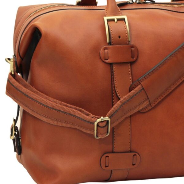 Close-up of Brown Full-Grain Leather Duffel Bag - Texture and Brass Hardware Detail - Amaz1a